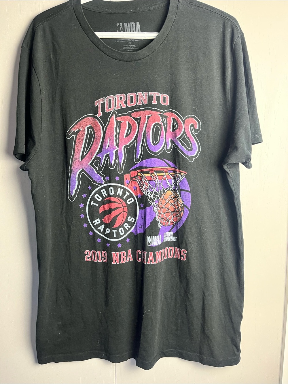 NBA Black Tee with Raptors Print. Size Large